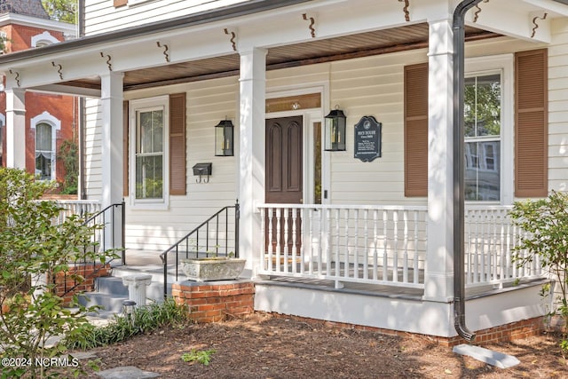 doorway to property with covered porch