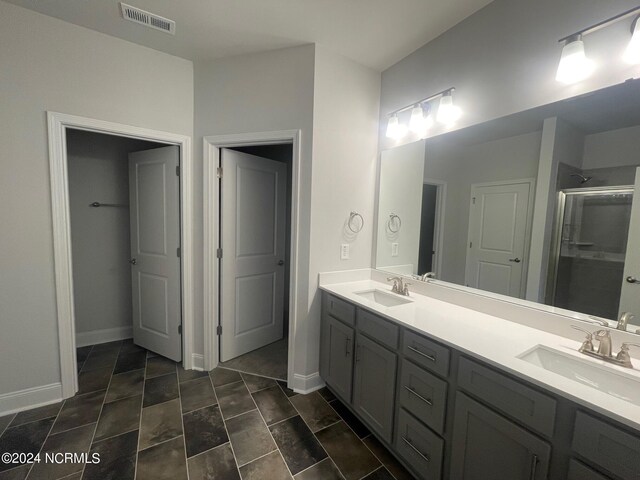 bathroom featuring vanity and walk in shower