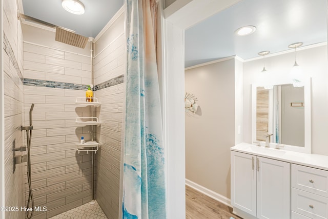 bathroom with hardwood / wood-style flooring, crown molding, vanity, and a shower with curtain