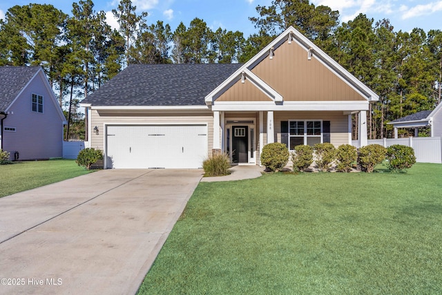 view of front of home featuring a garage, a porch, and a front yard