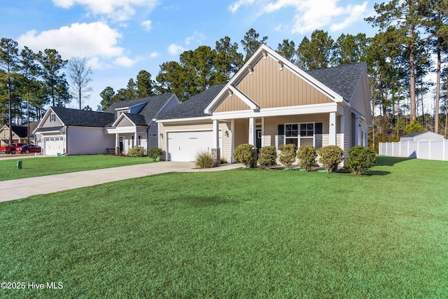 craftsman-style house with covered porch, a front lawn, and a garage