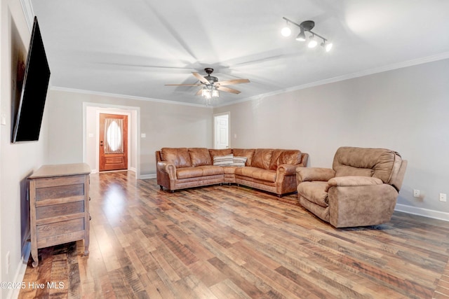 living room featuring hardwood / wood-style flooring, ceiling fan, and ornamental molding