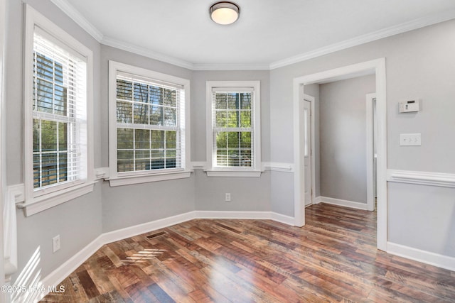 spare room with dark hardwood / wood-style floors and ornamental molding