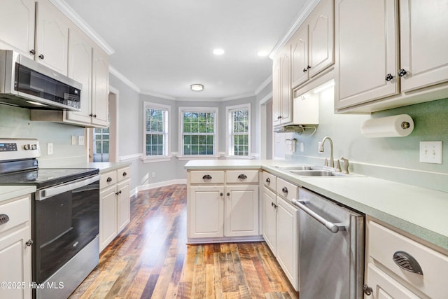 kitchen with white cabinets, sink, and stainless steel appliances