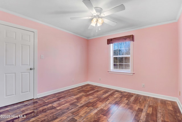 unfurnished room with dark hardwood / wood-style flooring, ceiling fan, and ornamental molding