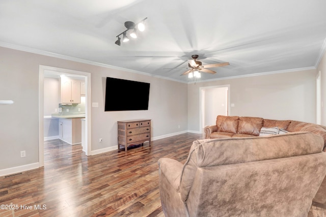 living room featuring wood-type flooring, ceiling fan, and ornamental molding