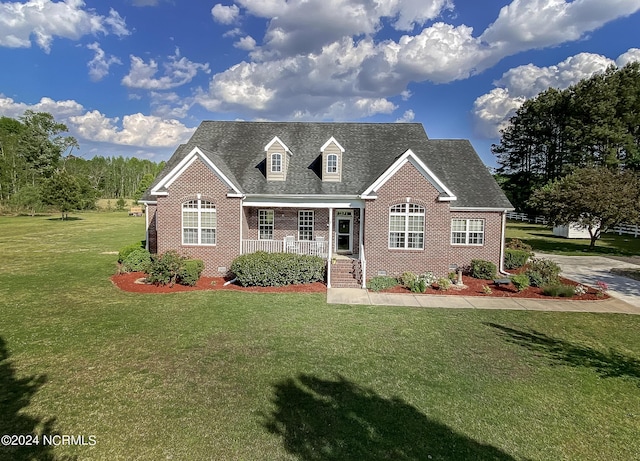 view of front facade with a porch and a front lawn