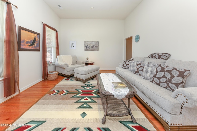 living room featuring wood finished floors and baseboards