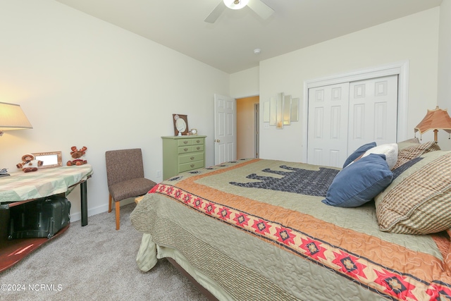 carpeted bedroom with ceiling fan and a closet