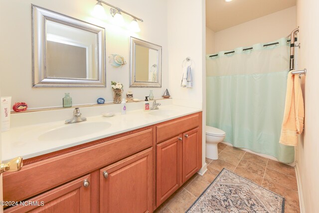 carpeted bedroom with ceiling fan, vaulted ceiling, and a closet