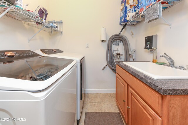 hall with light wood-type flooring and washer / dryer