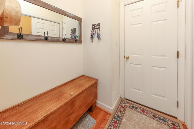 clothes washing area with washer and clothes dryer, sink, and cabinets