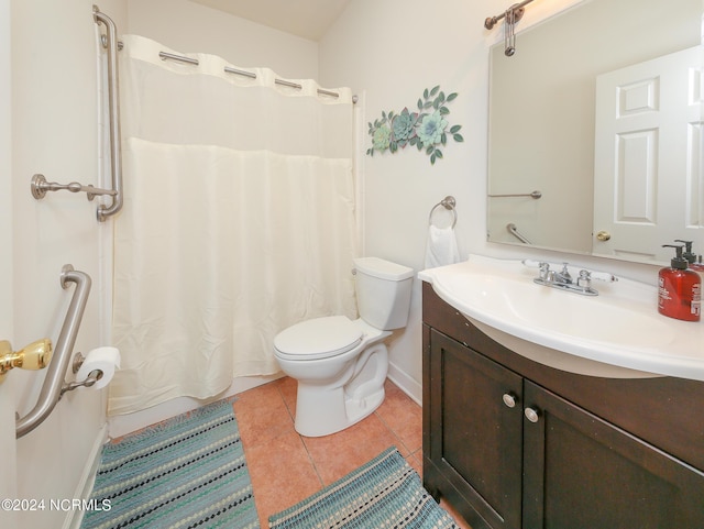 full bathroom with baseboards, vanity, toilet, and tile patterned floors