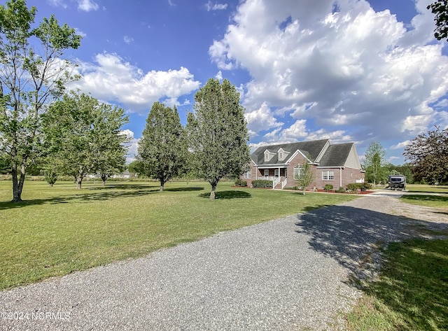 view of front of property with a front yard and driveway