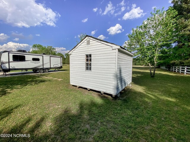 view of shed with fence