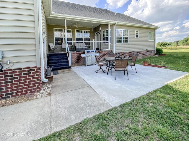 view of patio featuring grilling area and a ceiling fan