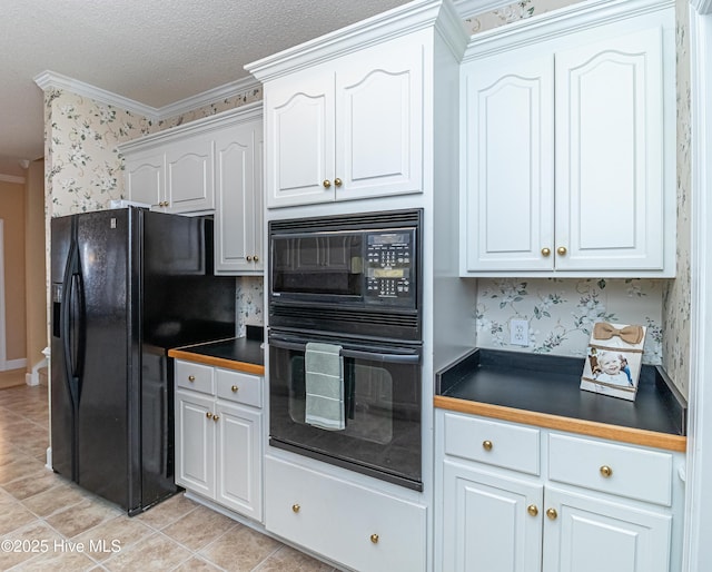 kitchen featuring white cabinetry, a textured ceiling, light tile patterned floors, black appliances, and ornamental molding