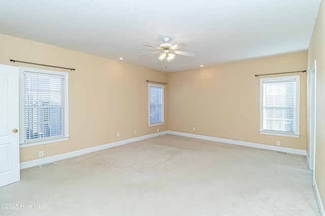 carpeted empty room with ceiling fan