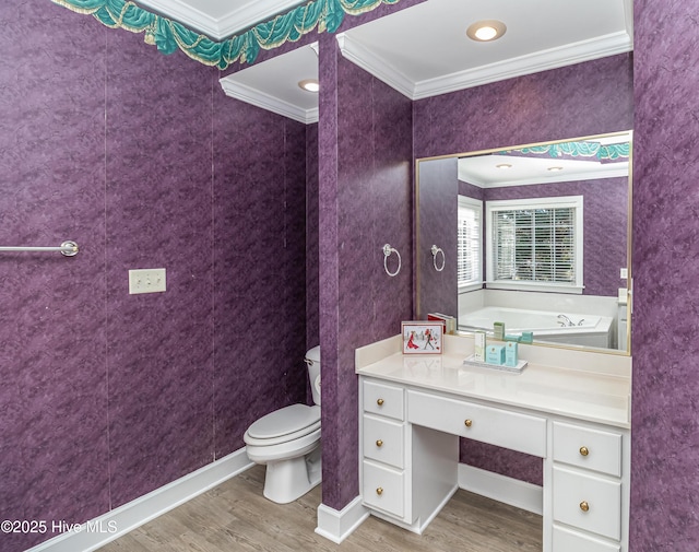 bathroom featuring toilet, hardwood / wood-style floors, and ornamental molding