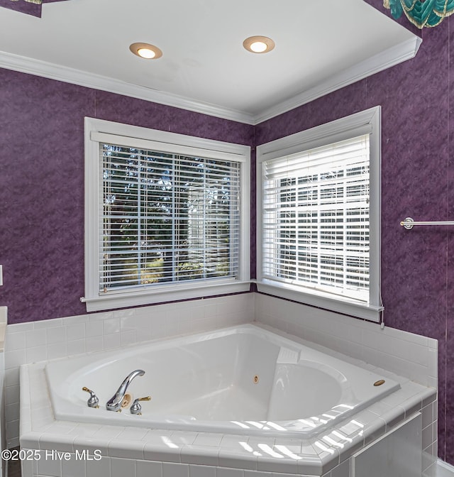 bathroom with tiled bath and crown molding