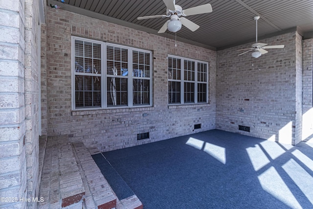 view of patio featuring ceiling fan