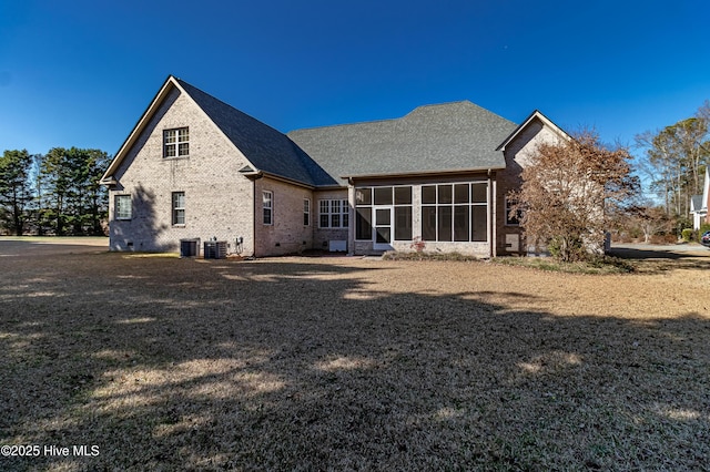 back of house featuring a sunroom and central AC