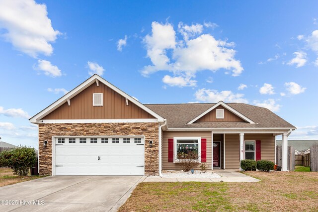 view of front of property featuring a garage and covered porch