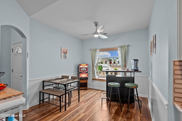 dining room featuring wood-type flooring and ceiling fan