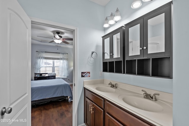 bathroom with ceiling fan, vanity, and hardwood / wood-style floors