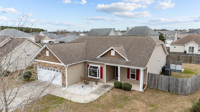 view of front of home featuring a garage and a front lawn