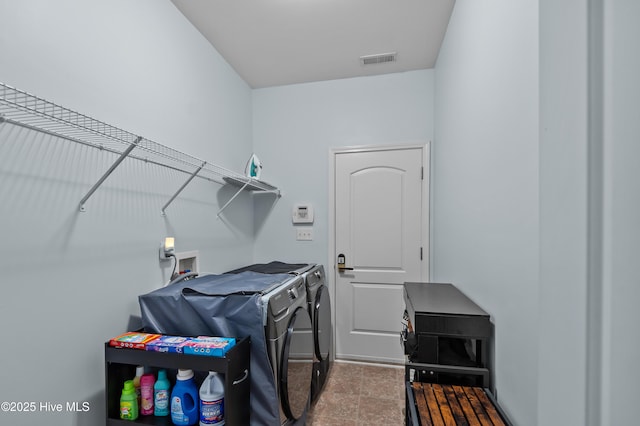 washroom featuring washer and clothes dryer