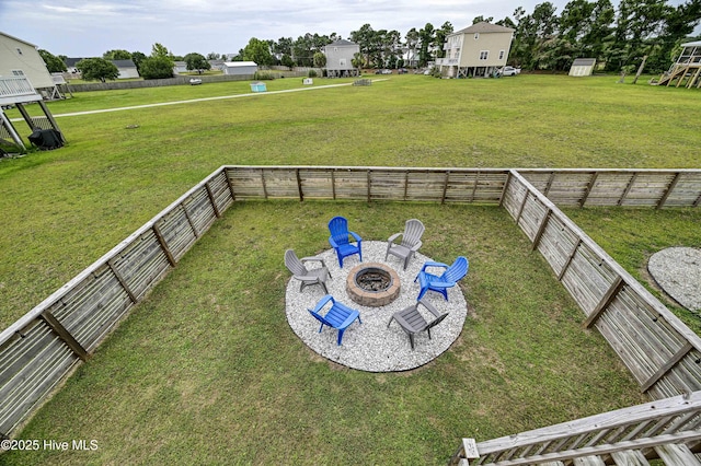 view of yard with a fire pit