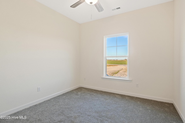 unfurnished room with ceiling fan and carpet floors