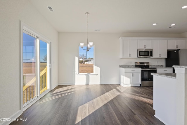 kitchen with stainless steel appliances, light stone counters, a chandelier, pendant lighting, and white cabinets