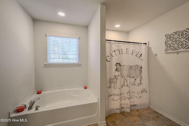 bathroom featuring a tub