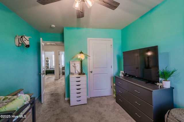 carpeted bedroom featuring ceiling fan