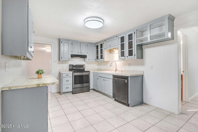 kitchen featuring dishwashing machine, sink, stainless steel electric stove, and gray cabinets