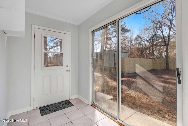 entryway featuring ornamental molding and light tile patterned floors