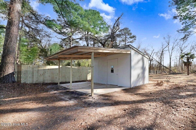 view of outdoor structure with a carport