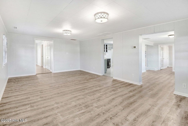 spare room featuring light hardwood / wood-style floors