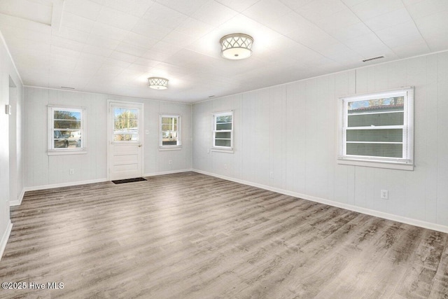 unfurnished room featuring light wood-type flooring