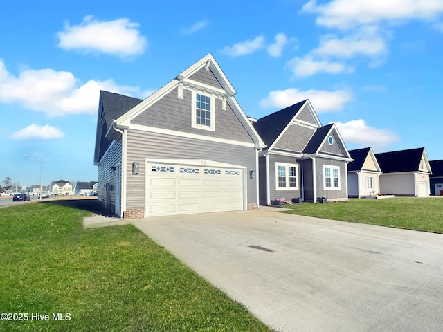 view of front of house featuring a garage and a front lawn