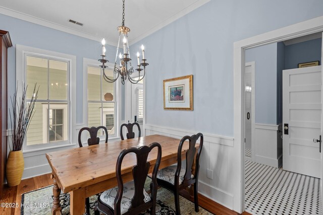 living room with ornamental molding, ceiling fan, and hardwood / wood-style floors