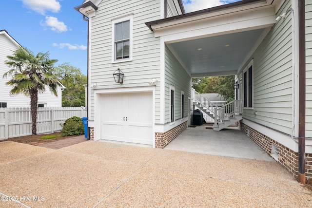 view of side of property featuring a garage