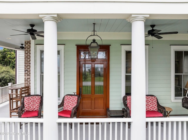 doorway to property with a porch and ceiling fan