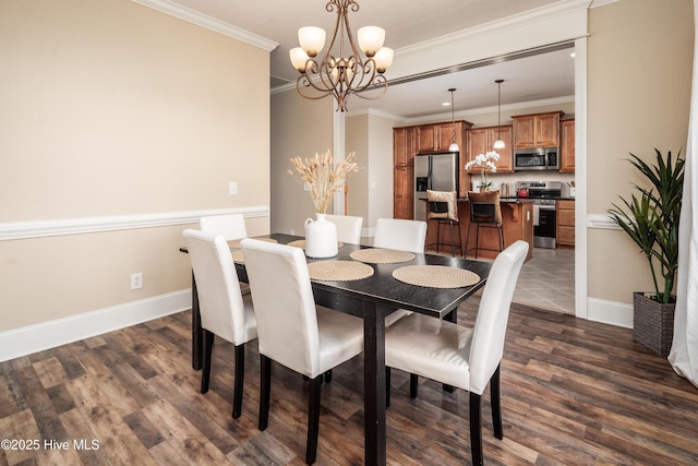 dining area featuring dark wood-type flooring, a notable chandelier, and ornamental molding