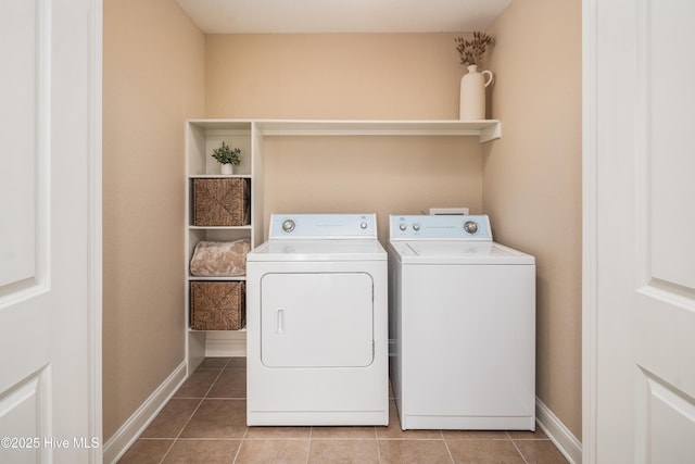 washroom with tile patterned floors and independent washer and dryer