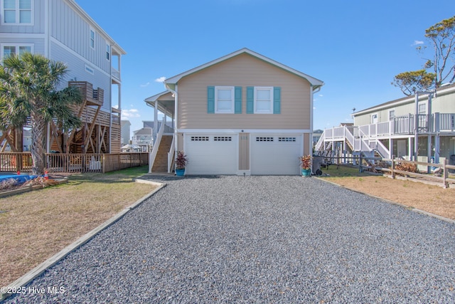 view of front of house with a garage and a front yard