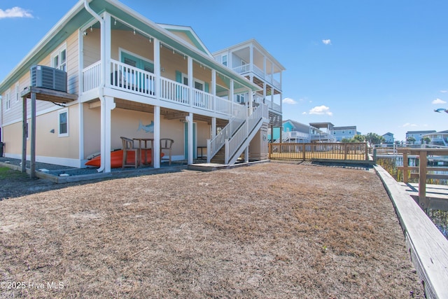 rear view of house featuring a balcony