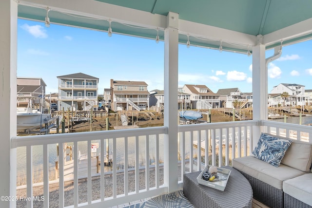 balcony featuring a water view